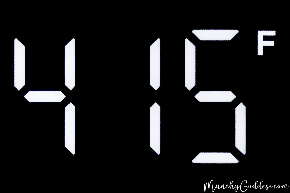 "415 F" being displayed in a white digital font on a black oven pane.