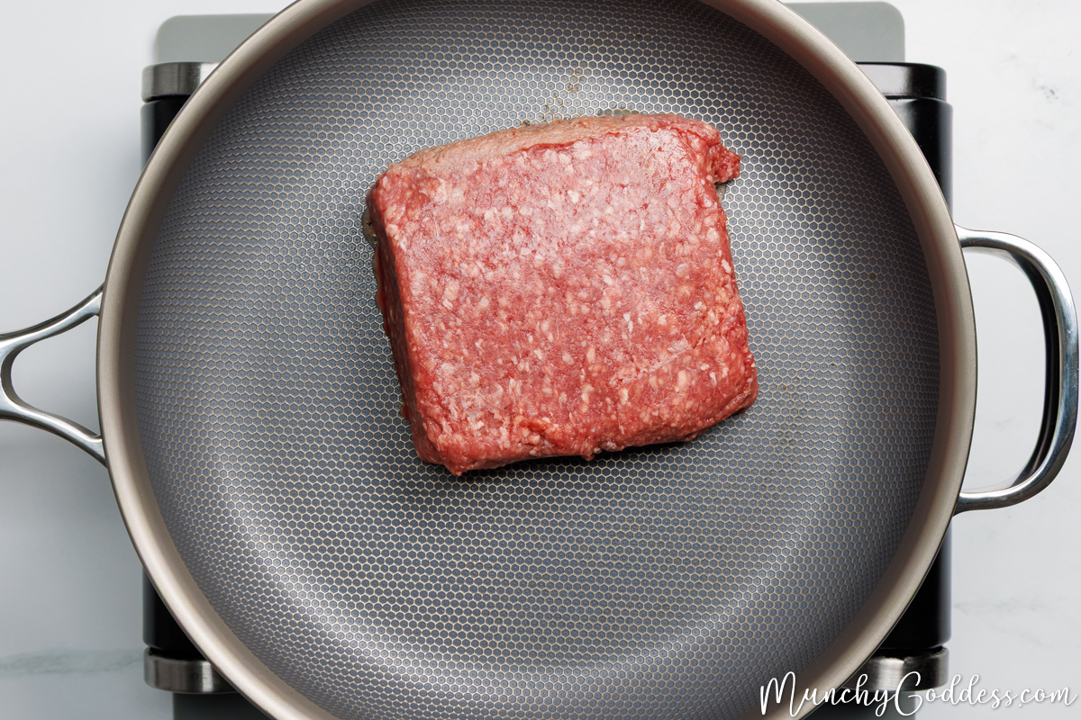 Ground beef in a pan ready to be cooked.
