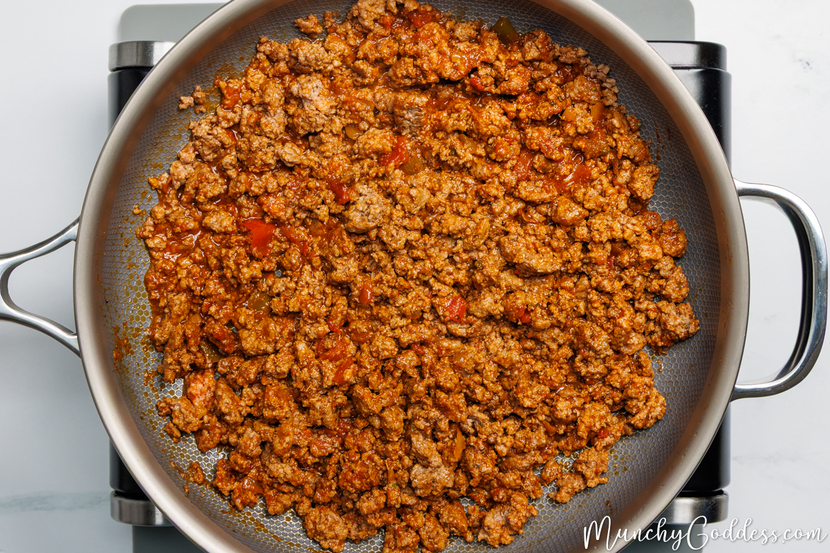 Browned ground beef, taco seasoning, chunky salsa, and water stirred in a pan until well blended.
