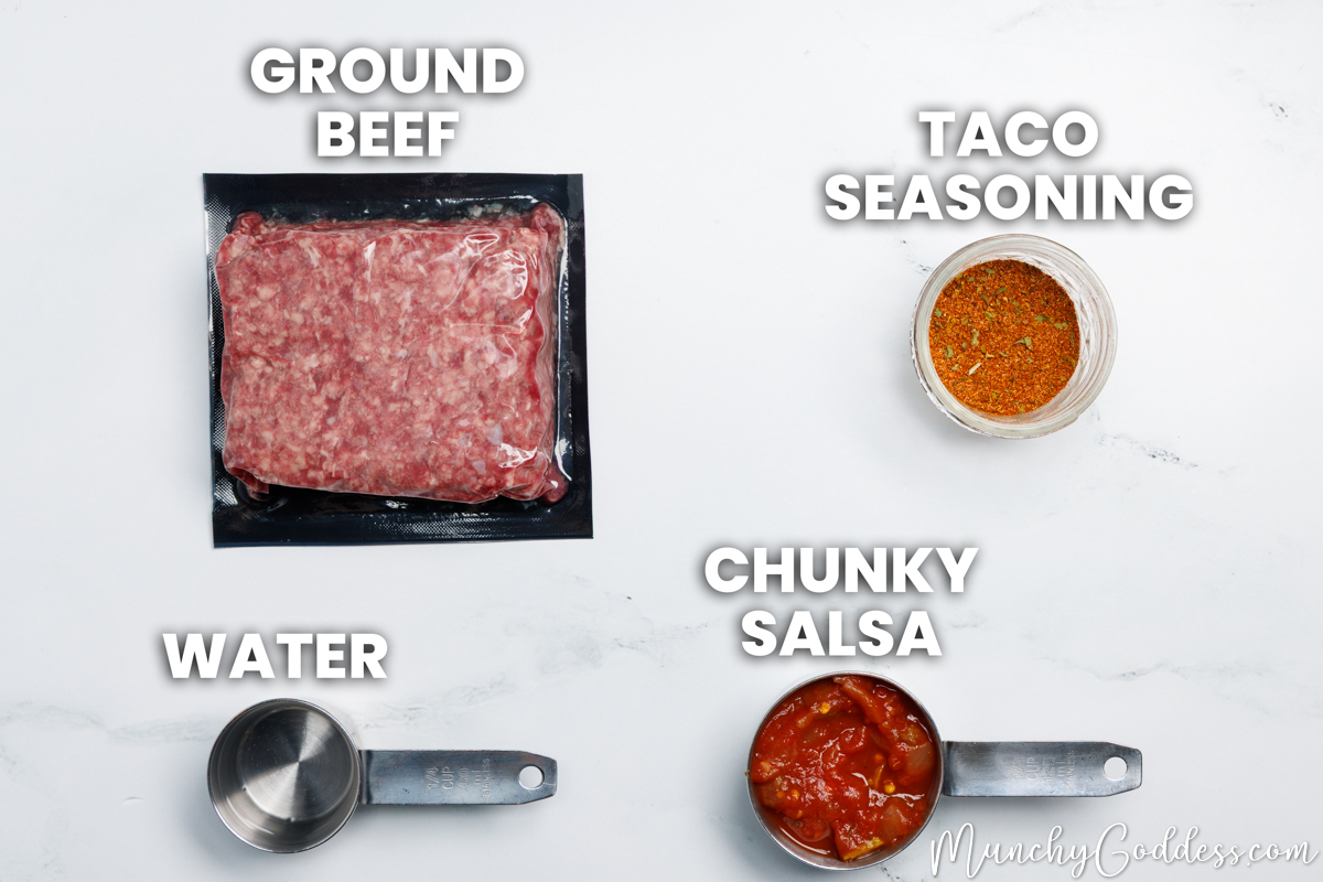 Taco meat recipe ingredients in various dishes on a white marble surface: ground beef, taco seasoning, chunky salsa, and water.