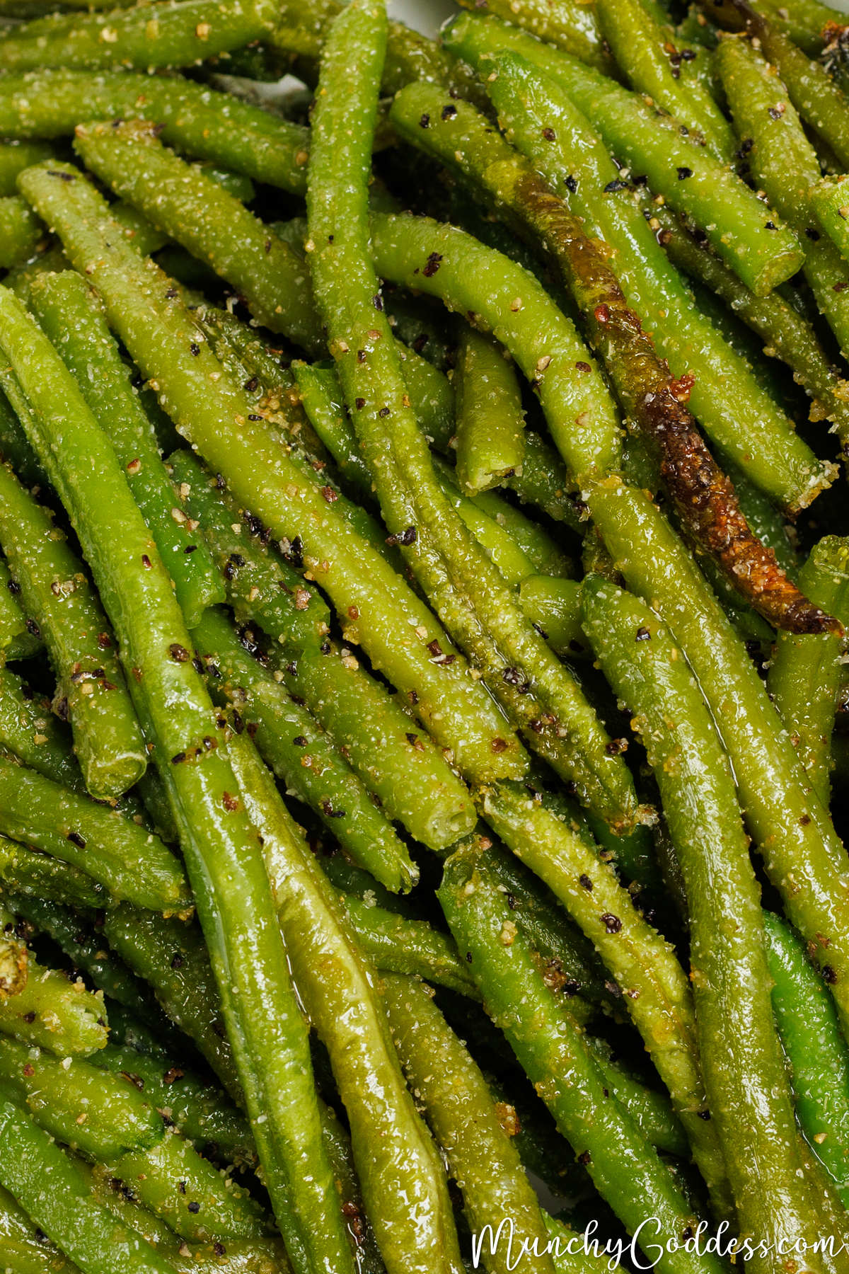 Roasted frozen green beans seasoned with salt, ground black pepper, garlic powder, and onion powder.